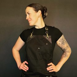 Bartender Clare sporting our new aprons.