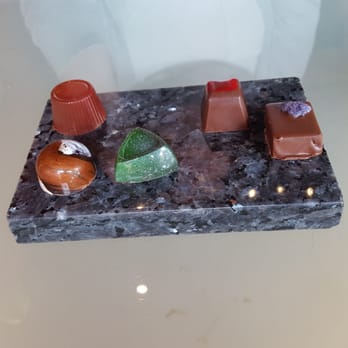 Infusion Chocolates - Served on a marble slab. Very cool and makes it easy to split chocolate to share. - Chocolatiers & Shops Near Me - Madison, Wisconsin