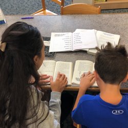 ImErica Education - Tutor reading with student