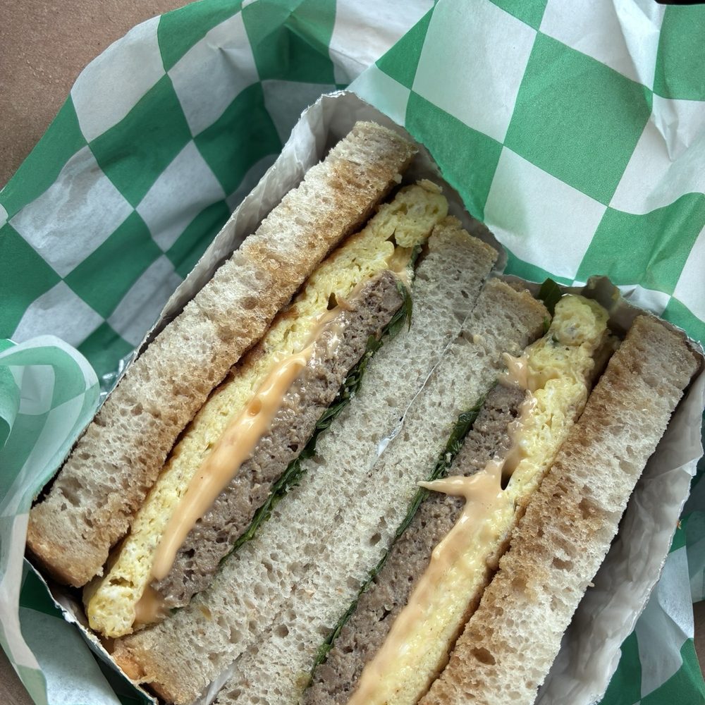 Artesano Cafe - Impossible Sausage Egg and Cheese w/Arugula and Maple Butter on Sourdough - Coffee Roasteries Near Me - Philadelphia, Pennsylvania Artesano Cafe - Impossible Sausage Egg and Cheese w/Arugula and Maple Butter on Sourdough - Coffee Roasteries Near Me - Philadelphia, Pennsylvania