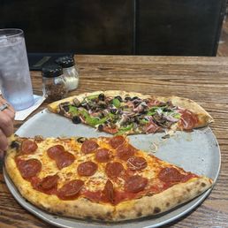 A large half pepperoni half supreme.