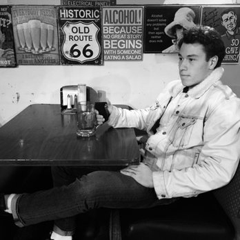 Fraternal Order of Eagles - Collegiate athlete from Sammamish chillin in a booth at the Redmond Eagles playroom. - Community Service/Non-Profit Near Me - Redmond, Washington