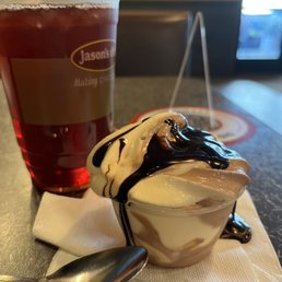 a dessert with ice cream and chocolate sauce