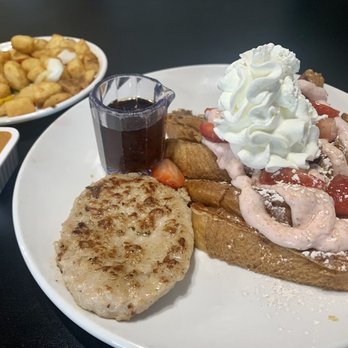 Nanna's Place - Strawberry French Toast with a side of sausage and Homemade fries with chefs hot sauce. Delish!!! - Cafes Near Me - Gresham, Oregon