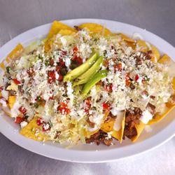 Nachos supremos. Fried tortilla chips with cheese and your choice of meat!
