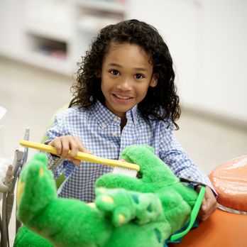 Sandra Brener & Associates - Learning to brush with some help from Dinno - Pediatric Dentists Near Me - Cooper City, Florida Sandra Brener & Associates - Learning to brush with some help from Dinno - Pediatric Dentists Near Me - Cooper City, Florida