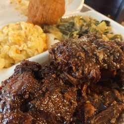 Mama T’s - Oxtails, macaroni and cheese, collard greens and cabbage mix