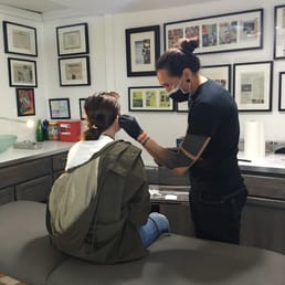 Fran's carefully measured and cleaned off the area being pierced.