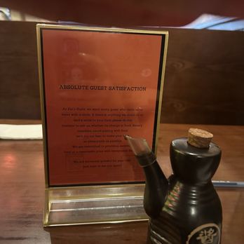 EAT'S SUSHI - Sign on table & soy sauce - Sushi Bars Near Me - Costa Mesa, California
