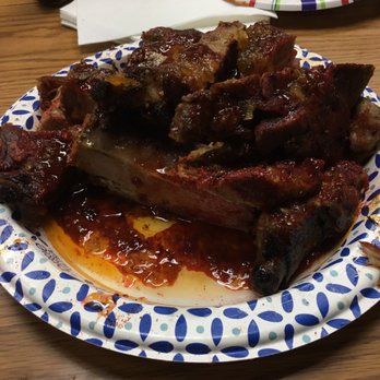 Hoboken Eddies - a plate of ribs on a table - Barbeque Near Me