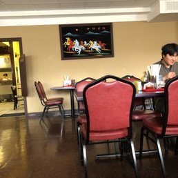 a man sitting at a table in a restaurant