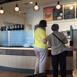 Caribou Coffee - You pick up your coffee and food at the end of the counter after ordering.