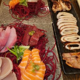 Top 8 piece sashimi, Bottom 16 piece sashimi and grilled whole squid! Top 8 piece sashimi, Bottom 16 piece sashimi and grilled whole squid!