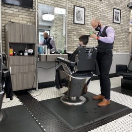 Daniel cutting my sons hair. Daniel cutting my sons hair.