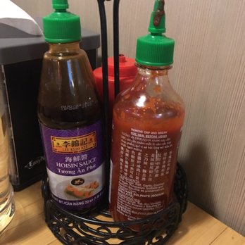 Sierra Noodle House - The hot sauce  bottle dirty , the cap to the other sauce has the wrong cap attached to the bottle which was dirty also . - Vietnamese Near Me - Fontana, California