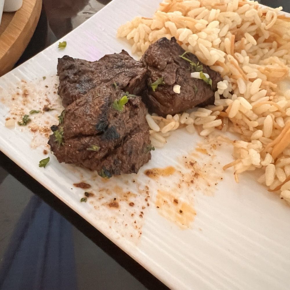 Fillet skewer and Arab rice Fillet skewer and Arab rice
