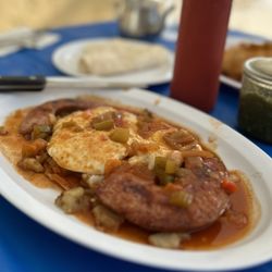 Cozy Cafe - Gaucho Platter with polish sausage and two eggs served over a tortilla and home fries with Spanish sauce. YUM.