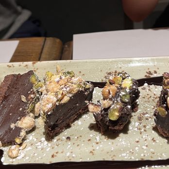 Trattoria San Lorenzo - Dark chocolate cake with pistachios - Trattorie Near Me - Florence, FI Trattoria San Lorenzo - Dark chocolate cake with pistachios - Trattorie Near Me - Florence, FI