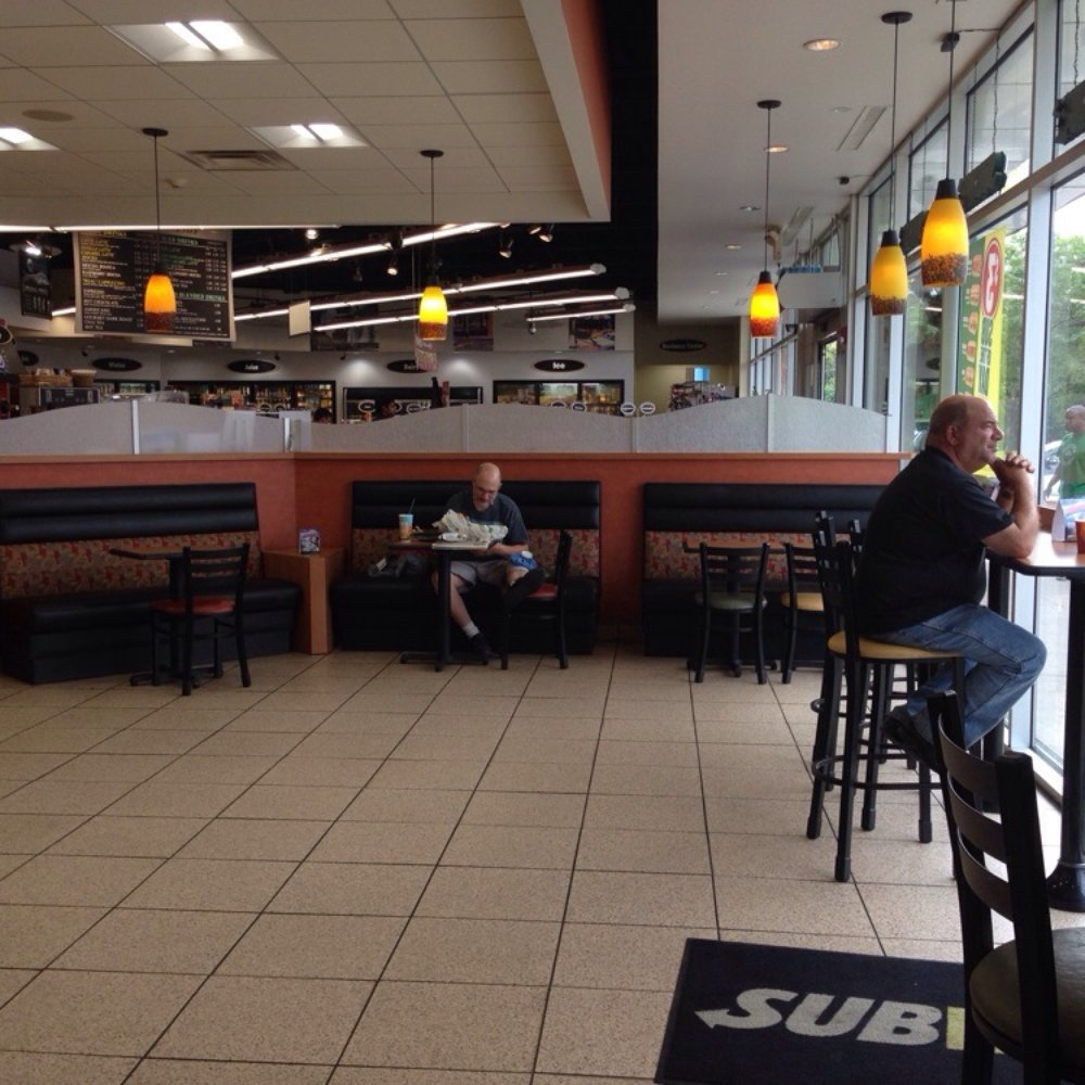 Subway - a man sitting at a table in a restaurant - Sandwiches Near Me - Des Plaines, Illinois Subway - a man sitting at a table in a restaurant - Sandwiches Near Me - Des Plaines, Illinois