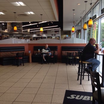 Subway - a man sitting at a table in a restaurant - Sandwiches Near Me - Des Plaines, Illinois