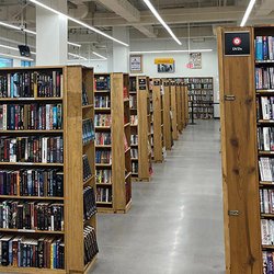 Half Price Books - DVD section and shelves of books at HPB Westlane Avenue, a new and used bookstore that buys and sells items in Columbus, Ohio.
