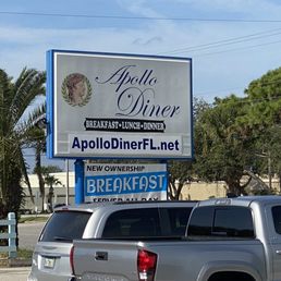 a truck parked in front of a restaurant