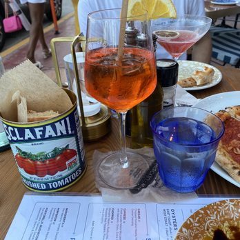 Mercato Ocean Drive - Warm crusty bread served in the tomato can Aperol Spritz, margherita pizza - Italian Near Me - Miami Beach, Florida Mercato Ocean Drive - Warm crusty bread served in the tomato can Aperol Spritz, margherita pizza - Italian Near Me - Miami Beach, Florida