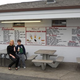 two women sitting at picnic tables