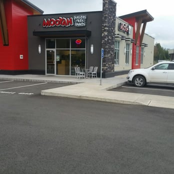 Mooyah - a car parked in front of a restaurant - Burgers Near Me - Chilliwack, British Columbia