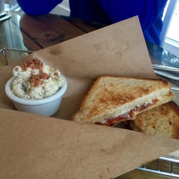 Idle Hour Biergarten - BAVARIAN GRILLED CHEESE gruyere, muenster, havarti, tomato jam, bacon on sourdough. German potato salad. - Bars Near Me - Atlantic Beach, North Carolina Idle Hour Biergarten - BAVARIAN GRILLED CHEESE gruyere, muenster, havarti, tomato jam, bacon on sourdough. German potato salad. - Bars Near Me - Atlantic Beach, North Carolina