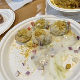 Their pathetic Dahi Bhalla Papdi Chaat. In the background is their Ragda Petties.