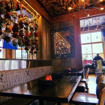 Mi Chola - a table and benches in a restaurant - Mexican Near Me - Aspen, Colorado