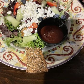 Miller's Waterfront Restaurant - Millers signature salad. Was supposed to be gluten free but they brought it out with this wafer and the server didn't care - Seafood Near Me - Nags Head, North Carolina Miller's Waterfront Restaurant - Millers signature salad. Was supposed to be gluten free but they brought it out with this wafer and the server didn't care - Seafood Near Me - Nags Head, North Carolina