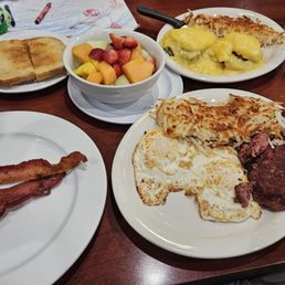 Corned beef hash, eggs Benedict, bacon, fruit bowl and sourdough. Corned beef hash, eggs Benedict, bacon, fruit bowl and sourdough.