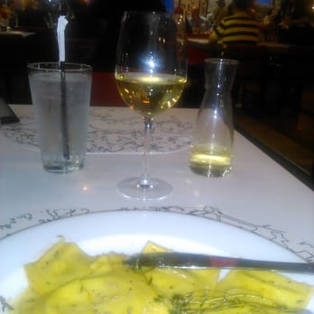 Due Amici - Mushroom ravioli and wine. Very good even by non-airport standards. Well worth trying. The sauce was wonderful. - Italian Near Me - Jamaica, New York
