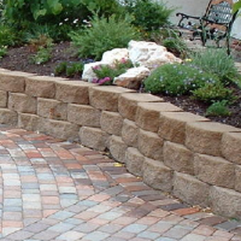 Northwoods Unlimited - a brick patio with a flower bed - Landscaping Near Me - Eau Claire, Wisconsin Northwoods Unlimited - a brick patio with a flower bed - Landscaping Near Me - Eau Claire, Wisconsin
