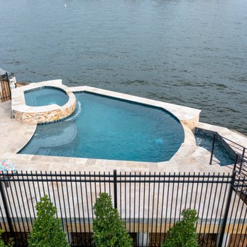 Pool Zones - Looking at infinity pool and travertine decking - Pool & Hot Tub Service Near Me - The Woodlands, Texas Pool Zones - Looking at infinity pool and travertine decking - Pool & Hot Tub Service Near Me - The Woodlands, Texas