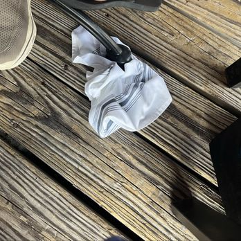 Channel Marker Cafe - what the waiter stuck under table to TRY to even it out - American Near Me - Lavallette, New Jersey