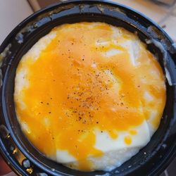 Harlem Breakfast Club - Side grits with gouda and cheddar cheese..MEH. BUT, try the sautéed shrimp and grits if you want grits. THAT'S delicious!