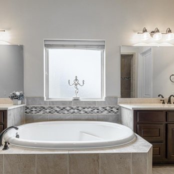 Lake Jones Realty - The primary bathroom has a Jack and Jill Ensuite with a grand garden tub. - Real Estate Agents Near Me Lake Jones Realty - The primary bathroom has a Jack and Jill Ensuite with a grand garden tub. - Real Estate Agents Near Me