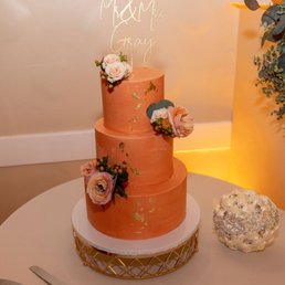 This was a tasty buttercream frosting in our color scheme decorated with golf leaf and flowers from our florist (Flower Blush). This was a tasty buttercream frosting in our color scheme decorated with golf leaf and flowers from our florist (Flower Blush).