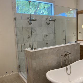 Gala Upgrade Solutions - a bathtub and shower in a bathroom - General Contractors Near Me Gala Upgrade Solutions - a bathtub and shower in a bathroom - General Contractors Near Me