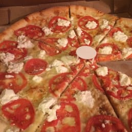 White pizza with garlic, tomatoes and ricotta. White pizza with garlic, tomatoes and ricotta.