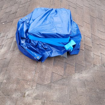 Chimcare Portland - Chimney hole covered with blue tape. - Masonry/Concrete Near Me - Portland, Oregon Chimcare Portland - Chimney hole covered with blue tape. - Masonry/Concrete Near Me - Portland, Oregon