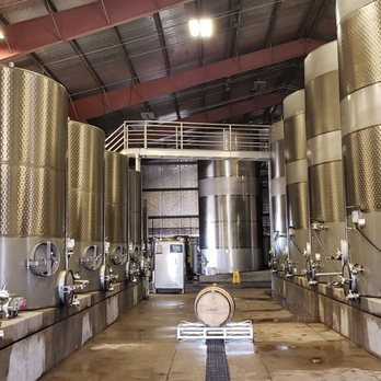 Peltier Winery - fermentation tanks and a Fontainebleau oak barrel carrying Peltier's 2017 Cabernet Sauvignon - Wineries Near Me - Acampo, California