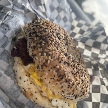 Ray's Donuts - a breakfast sandwich on a checkered paper wrapper - Donuts Near Me - Jonesboro, Georgia Ray's Donuts - a breakfast sandwich on a checkered paper wrapper - Donuts Near Me - Jonesboro, Georgia