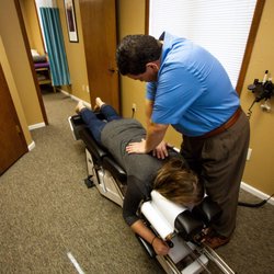 Toby Ficklin Chiropractic & Sports Therapy - Dr. Ficklin adjusting a patient