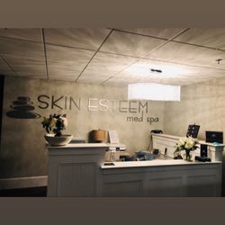 Skin Esteem Med Spa - Our custom made desk and signage
