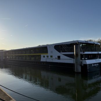 Gate 1 Travel - Gate 1 Travel's Monarch Countess river cruise ship, docked on the Seine river in Conflans, France. - Travel Services Near Me - Fort Washington, Pennsylvania Gate 1 Travel - Gate 1 Travel's Monarch Countess river cruise ship, docked on the Seine river in Conflans, France. - Travel Services Near Me - Fort Washington, Pennsylvania