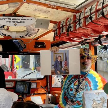 Boston Duck Tours - Ripple holding up a photo of Mitt Romney, former governor of Massachusetts - Tours Near Me - Boston, Massachusetts